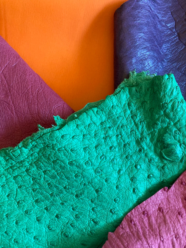 Close-up of atelier &LAB multi-colored upcycled full-grain Premium leather, revealing refined natural grain and soft matte texture.