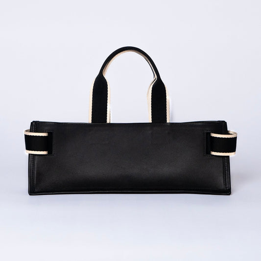Minimal structured leather tote bag — NUMÉRO 02 PLAT by atelier &LAB, black upcycled full-grain calf leather, rear view showing a clean flat structured silhouette.