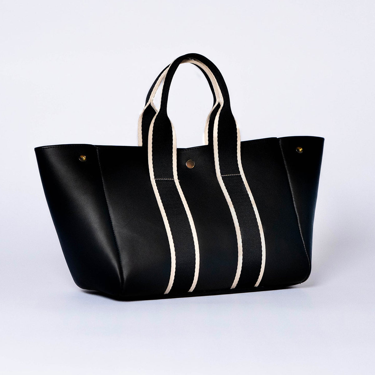 Everyday leather tote bag — NUMÉRO 03 by atelier &LAB, black upcycled full-grain calf leather, front three-quarter view showing an open shape and easy access for daily essentials.