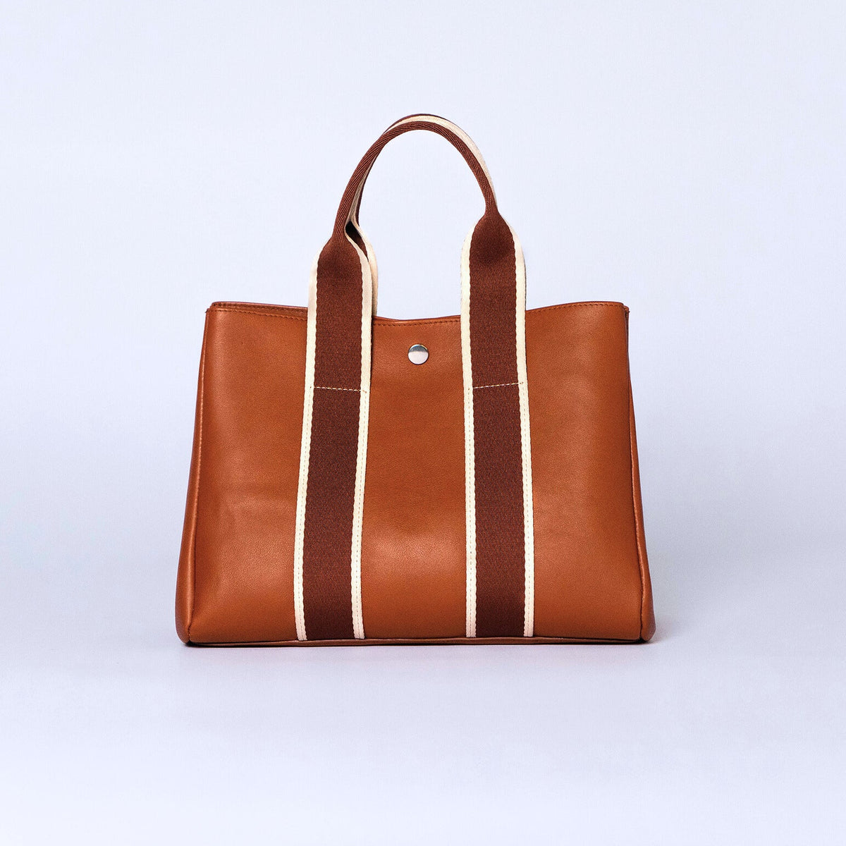 Everyday leather tote bag — NUMÉRO 03 by atelier &LAB, cognac upcycled full-grain calf leather, rear view showing an open shape and easy access for daily essentials.