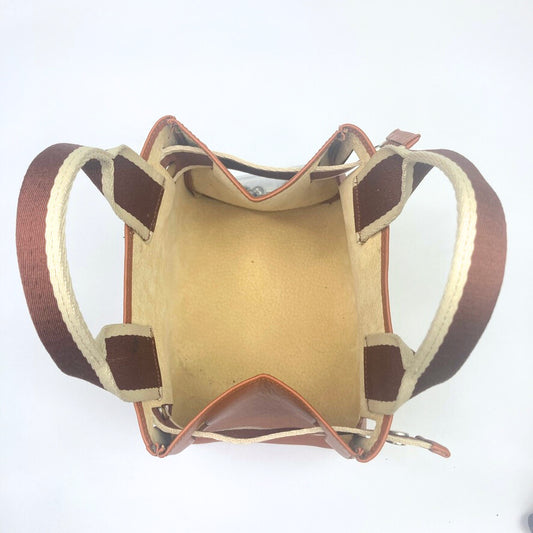 Structured leather mini handbag — NUMÉRO 04 Mini by atelier &LAB, cognac upcycled full-grain calf leather, interior view showing an open compartment and structured construction designed for everyday essentials.