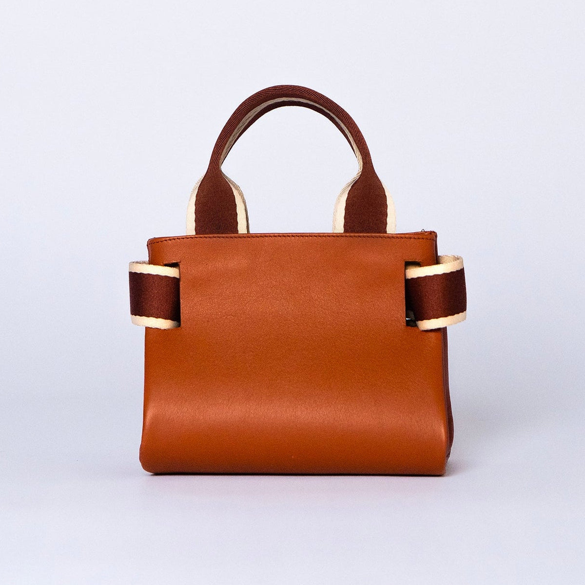 Mini leather handbag in cognac — NUMÉRO 04 by atelier &LAB, rear view, compact graphic shape