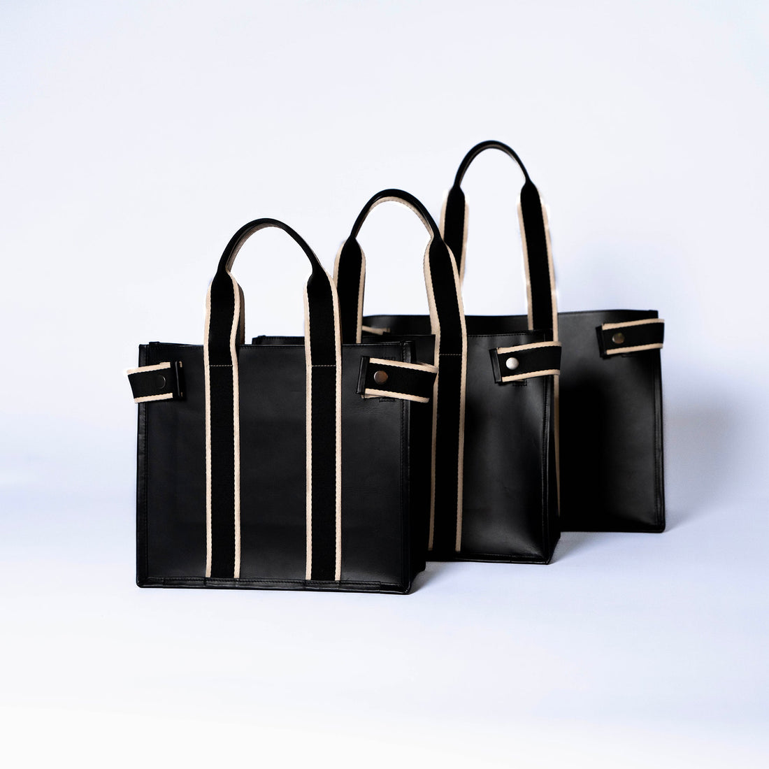 Structured leather tote bags — NUMÉRO 01 by atelier &LAB, black, large medium and small sizes grouped, front view