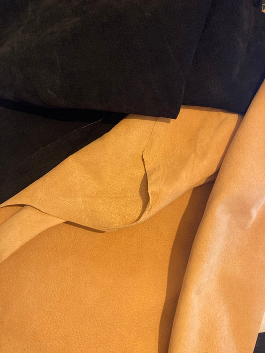 Close-up of natural leather lining, showing material texture and structural use.