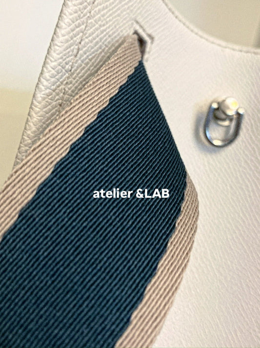 structured leather tote bag detail showing lining and strap construction — atelier &LAB Paris design studio