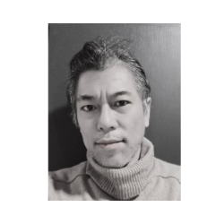 Black and white portrait of Hiroki Amano, founder of atelier &LAB, in the studio