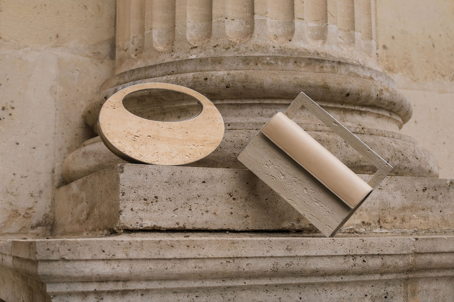 ARCHIVE 01 (circle) & ARCHIVE 02 (rectangular) — atelier &LAB Mineral Composite (stone-based material) bags, Minimalist Brutalist Design, Premium beige leather details, Paris.
