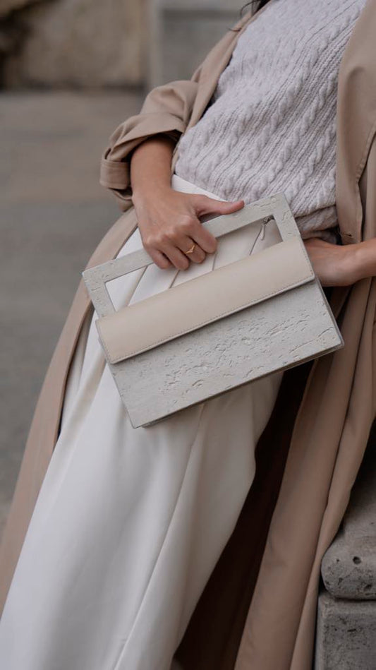 ARCHIVE 02 by atelier &LAB — sculptural mineral composite (stone-based material) clutch, an architectural gesture at the Louvre, Paris — atelier &LAB