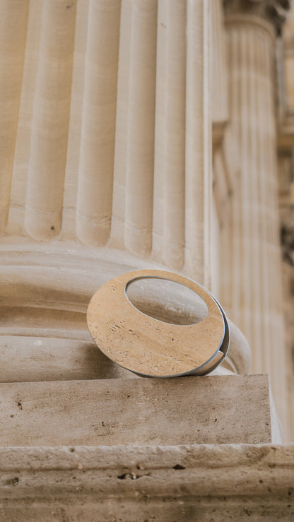 Mineral composite sculptural object — MINERAL 01 by atelier &LAB, frontal view highlighting the circular structured form and architectural presence in mineral composite material, Paris design studio.