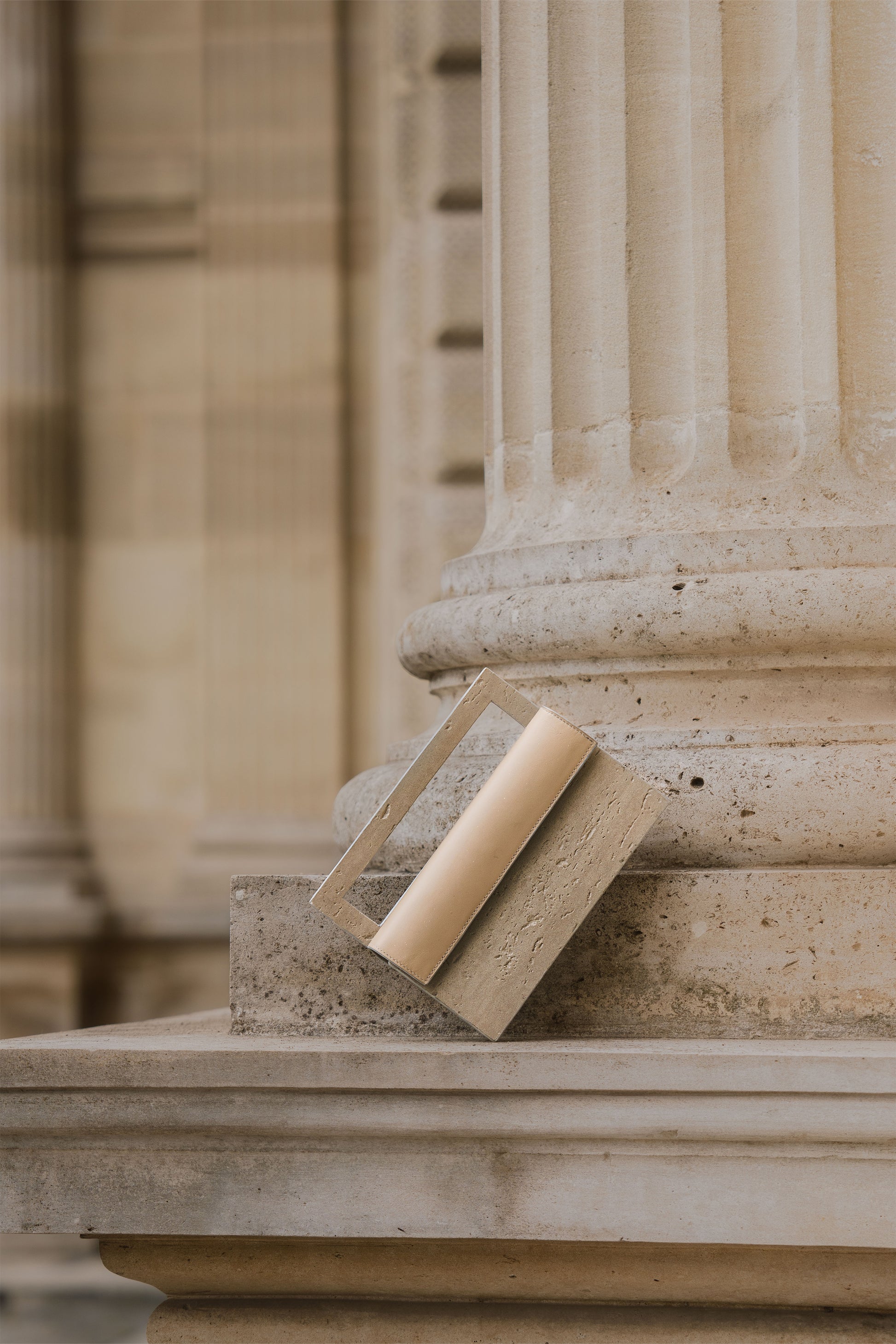 Mineral composite sculptural object — MINERAL 02 by atelier &LAB, frontal view highlighting the rectangular structured form and architectural presence in mineral composite material, Paris design studio.