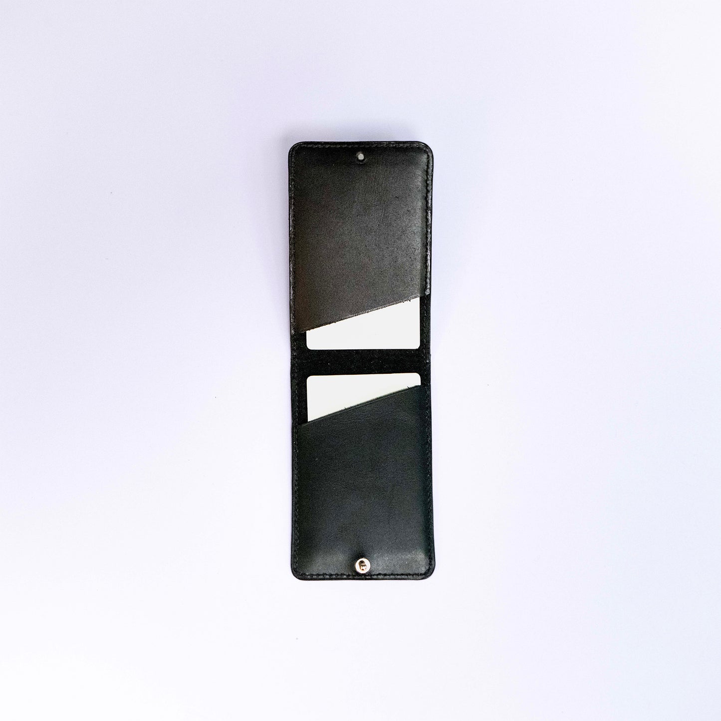 MagSafe compatible leather smartphone card holder — MODULE Pliable by atelier &LAB, black upcycled full-grain calf leather shown open, Paris design studio.