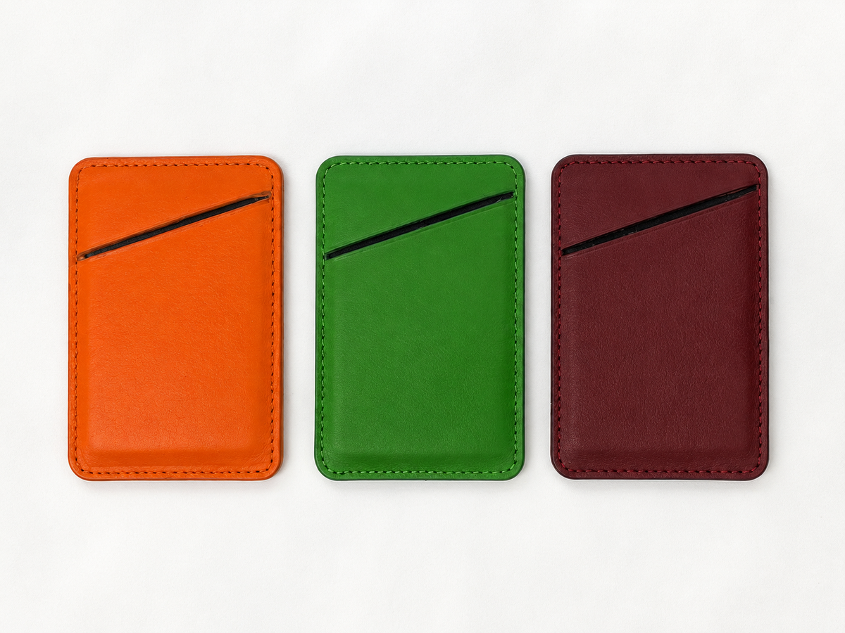 Three MODULE Simple leather card holders by atelier &LAB in orange, green and bordeaux upcycled full-grain calf leather, designed and made near Paris.