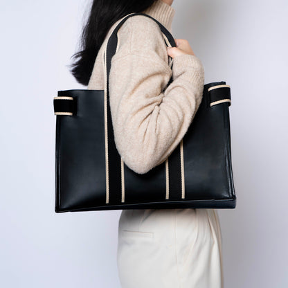 NUMÉRO 01 by atelier &LAB — worn on shoulder, rear view conveying an effortless quiet luxury attitude in premium upcycled full-grain calf leather, Paris.