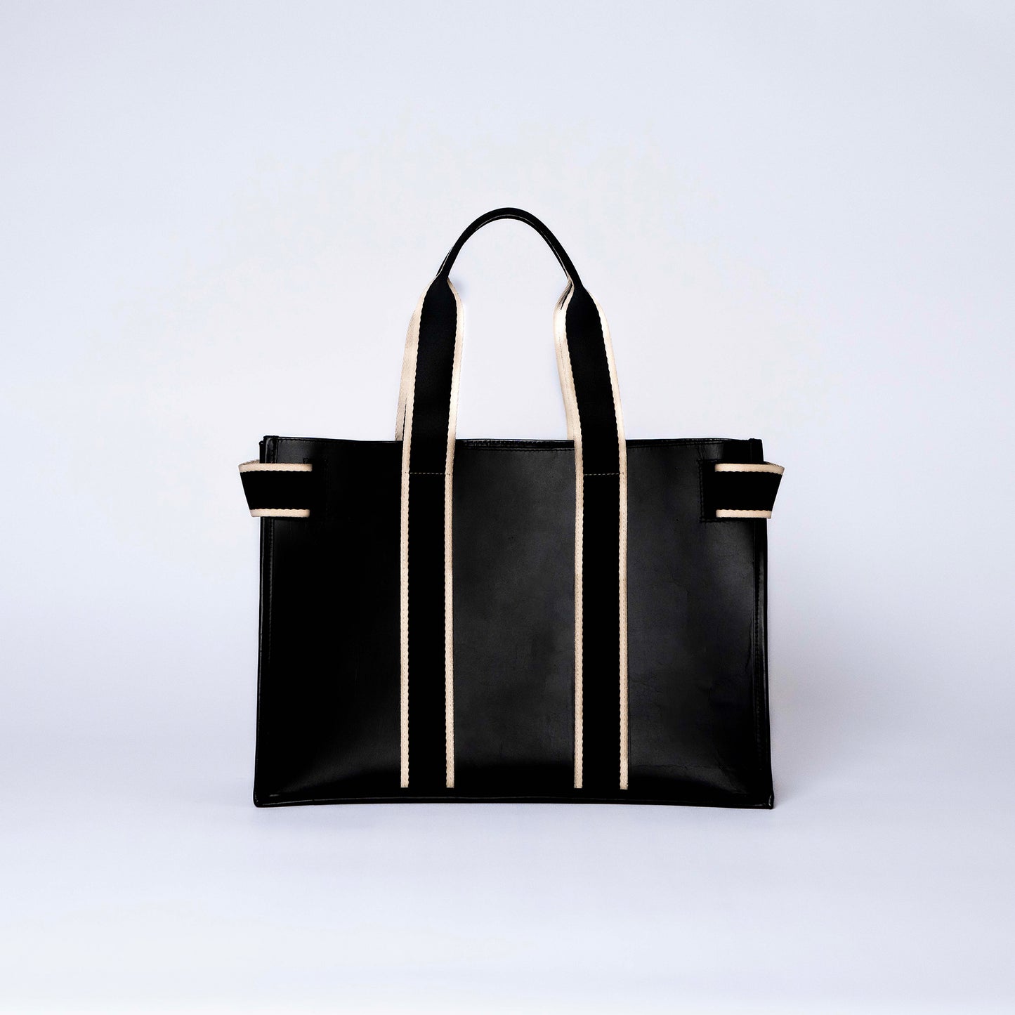 NUMÉRO 01 by atelier &LAB — rear view expressing a clean, structured presence with refined proportions in premium upcycled full-grain calf leather, Paris.