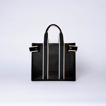 Structured leather tote bag — NUMÉRO 01 S by atelier &LAB, front view showing compact structured shape in black calf leather