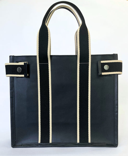 Structured leather tote bag — NUMÉRO 01 S prototype by atelier &LAB, frontal view showing structured silhouette and vertical straps