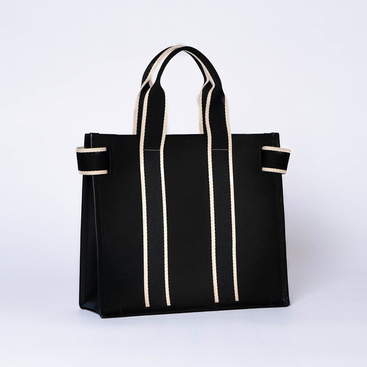 Structured leather tote bag — NUMÉRO 01 S by atelier &LAB, rear three-quarter view showing structured silhouette in black upcycled full-grain calf leather