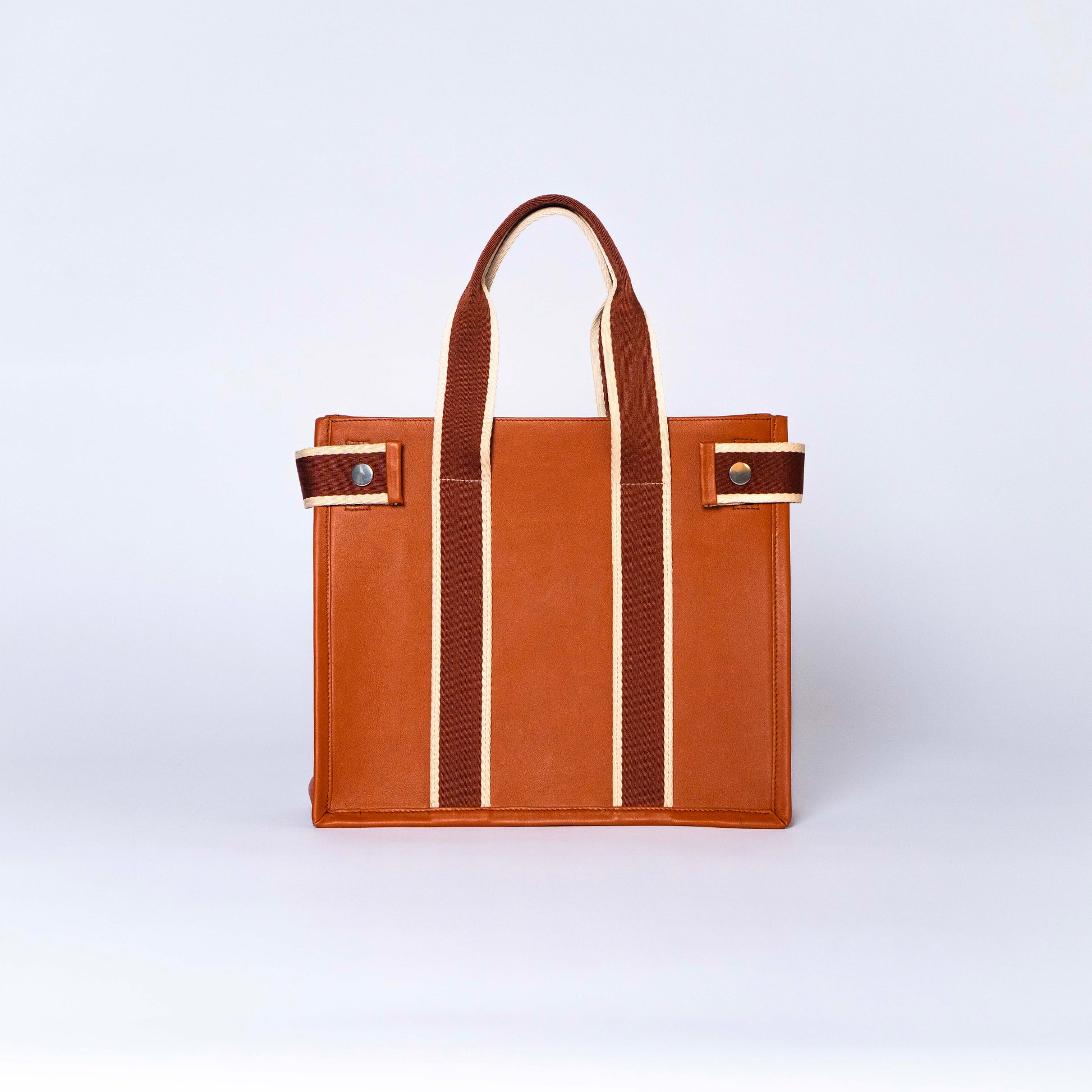 NUMÉRO 01 by atelier &LAB — frontal view capturing a strong, geometric silhouette with a premium, quiet luxury attitude in upcycled full-grain calf leather, atelier &LAB, Paris.