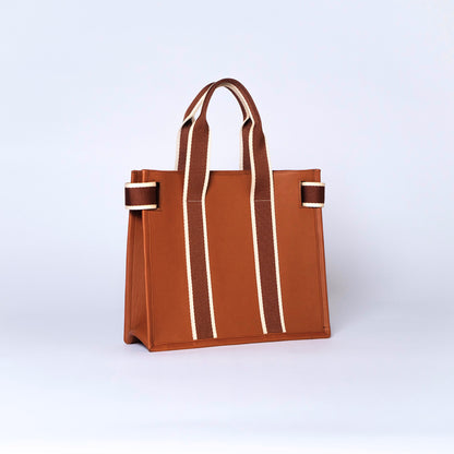 Structured leather tote bag — NUMÉRO 01 S by atelier &LAB, rear three-quarter view showing structured silhouette in cognac upcycled full-grain calf leather