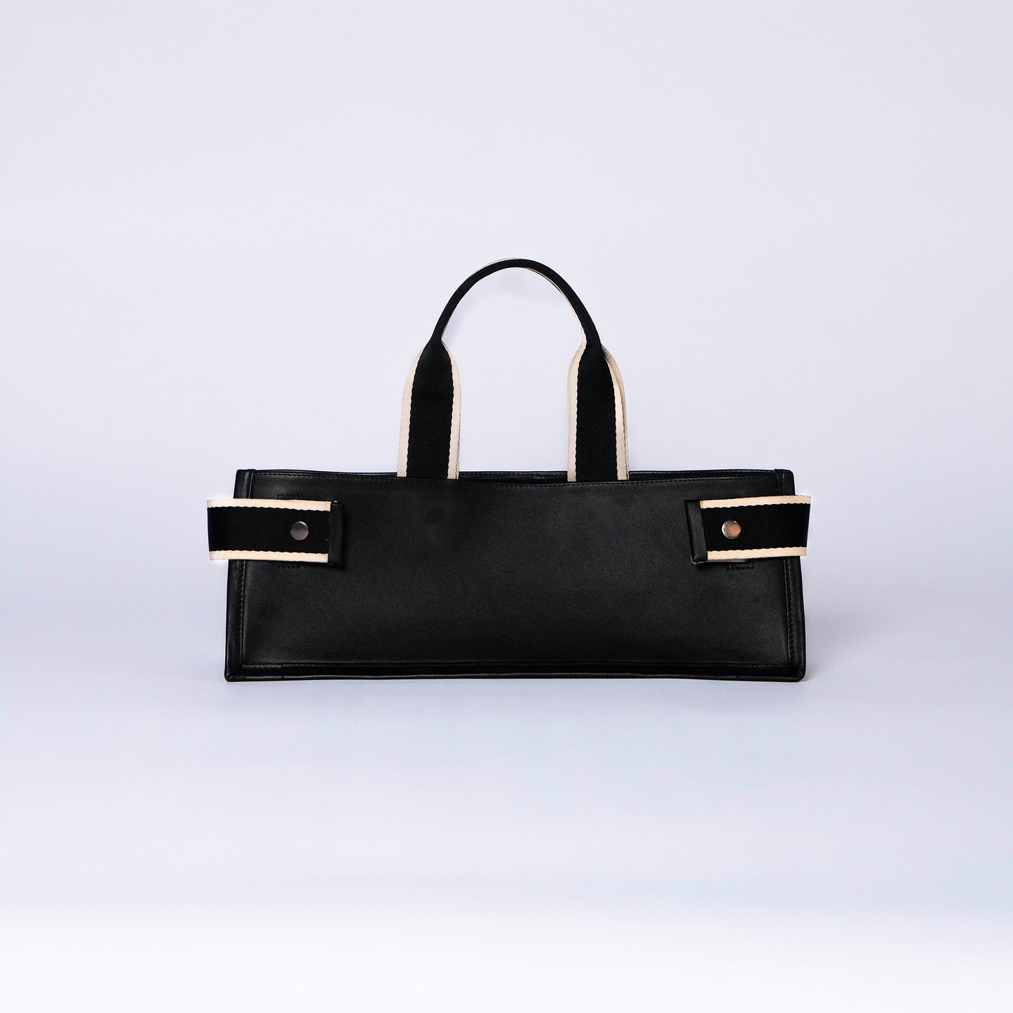 NUMÉRO 02 by atelier &LAB — Large flat tote bag in black. Structured horizontal silhouette, front view. Premium upcycled full-grain calf leather, brutalist aesthetic, Paris.