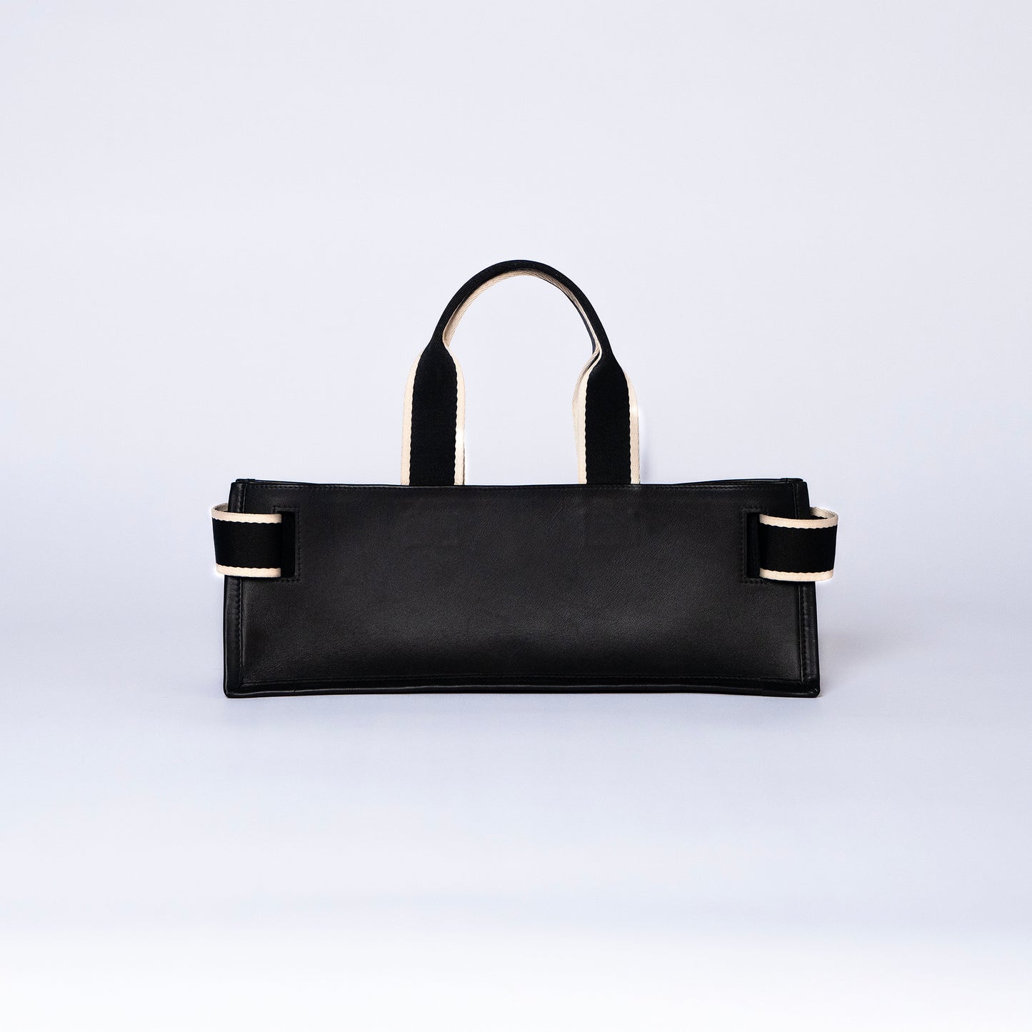 NUMÉRO 02 by atelier &LAB — Large flat tote bag in black. Structured horizontal silhouette, rear view. Premium upcycled full-grain calf leather, brutalist aesthetic, Paris.