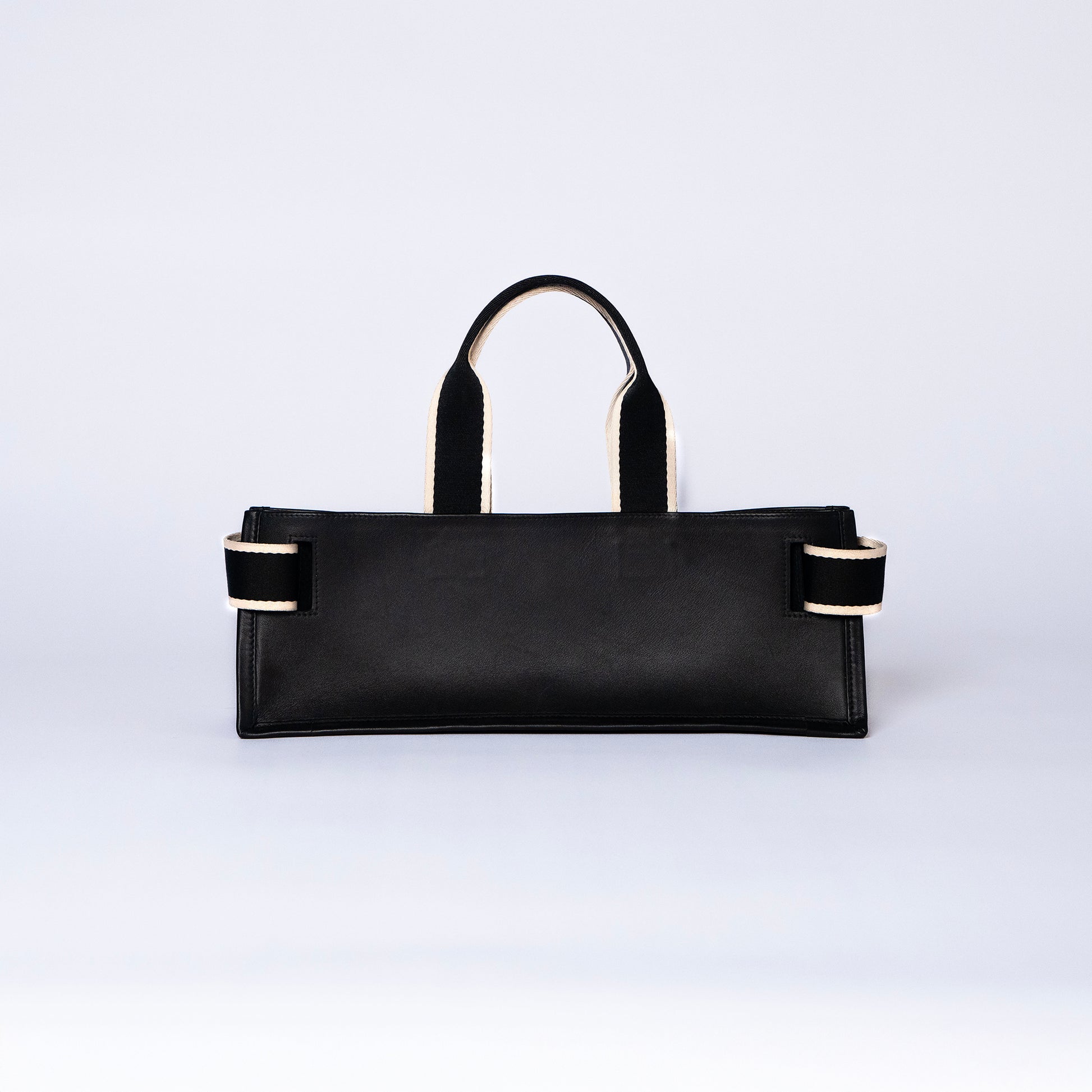 NUMÉRO 02 by atelier &LAB — Large flat tote bag in black. Structured horizontal silhouette, rear view. Premium upcycled full-grain calf leather, brutalist aesthetic, Paris.