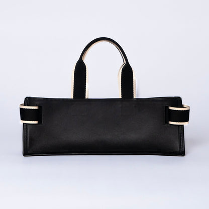 Minimal structured leather tote bag — NUMÉRO 02 PLAT by atelier &LAB, black upcycled full-grain calf leather, rear view showing a clean flat structured silhouette.