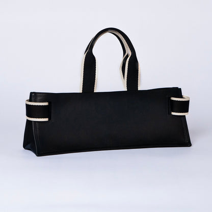 Minimal structured leather tote bag — NUMÉRO 02 PLAT by atelier &LAB, black upcycled full-grain calf leather, rear three-quarter view showing a clean flat structured silhouette.