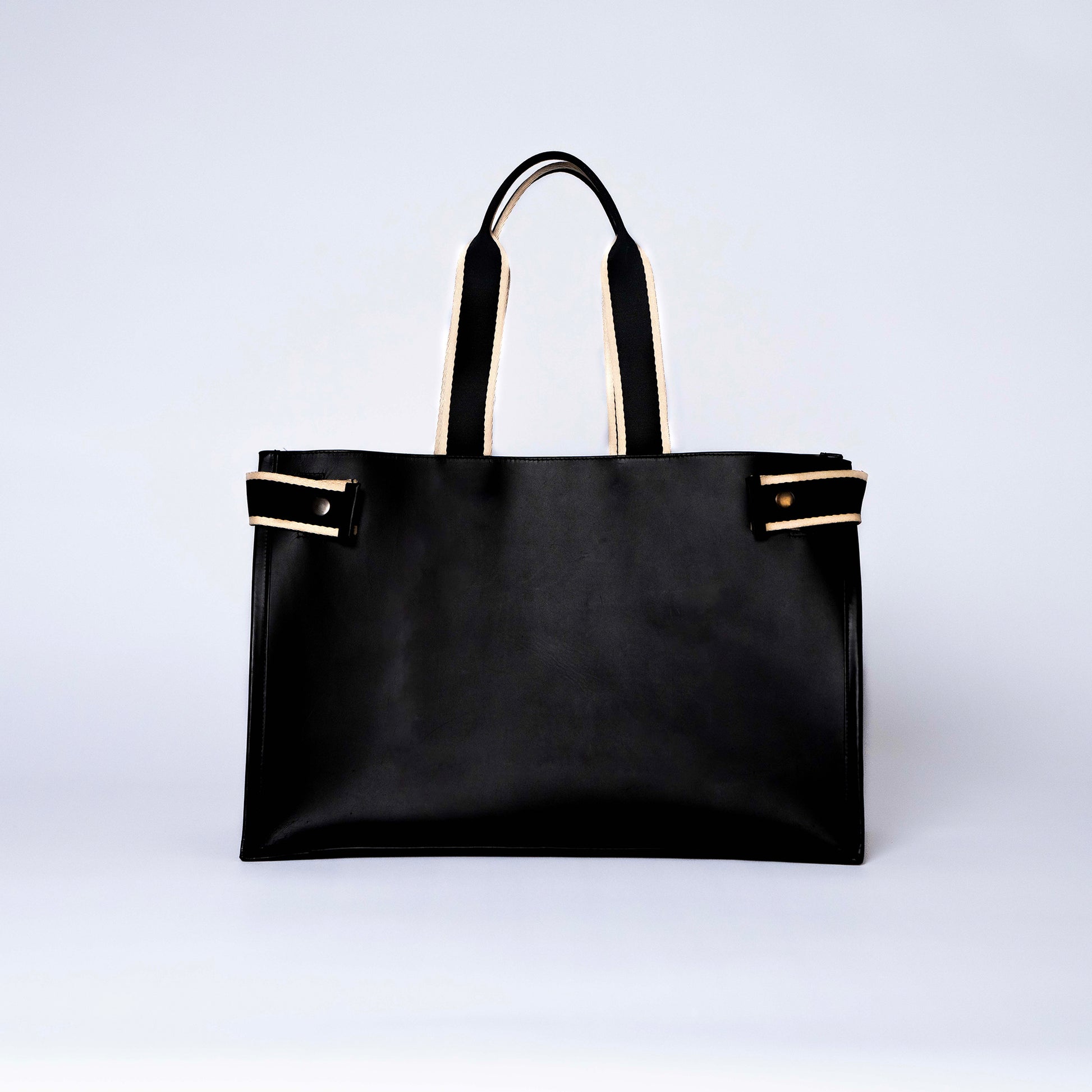 NUMÉRO 02 by atelier &LAB — front view highlighting a refined, graphic façade with sculpted volume in premium upcycled full-grain calf leather, Paris.