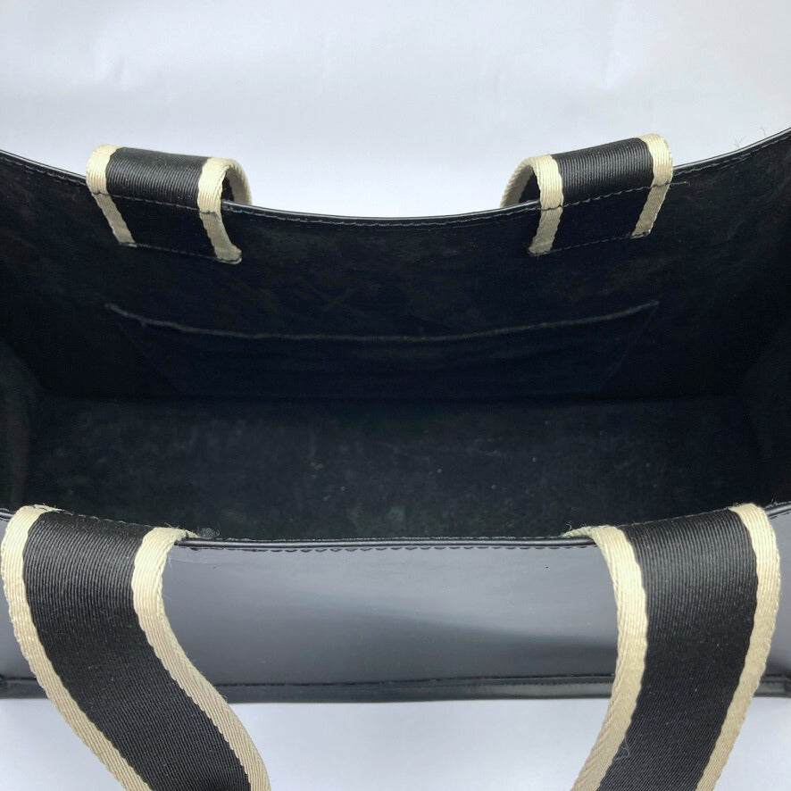 Minimal structured leather tote bag — NUMÉRO 02 by atelier &LAB, black upcycled full-grain calf leather, interior view showing clean construction and structured shape.