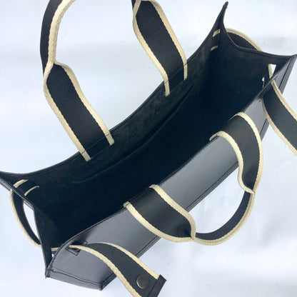 Minimal structured leather tote bag — NUMÉRO 02 by atelier &LAB, black upcycled full-grain calf leather, top interior view showing clean construction and structured shape.