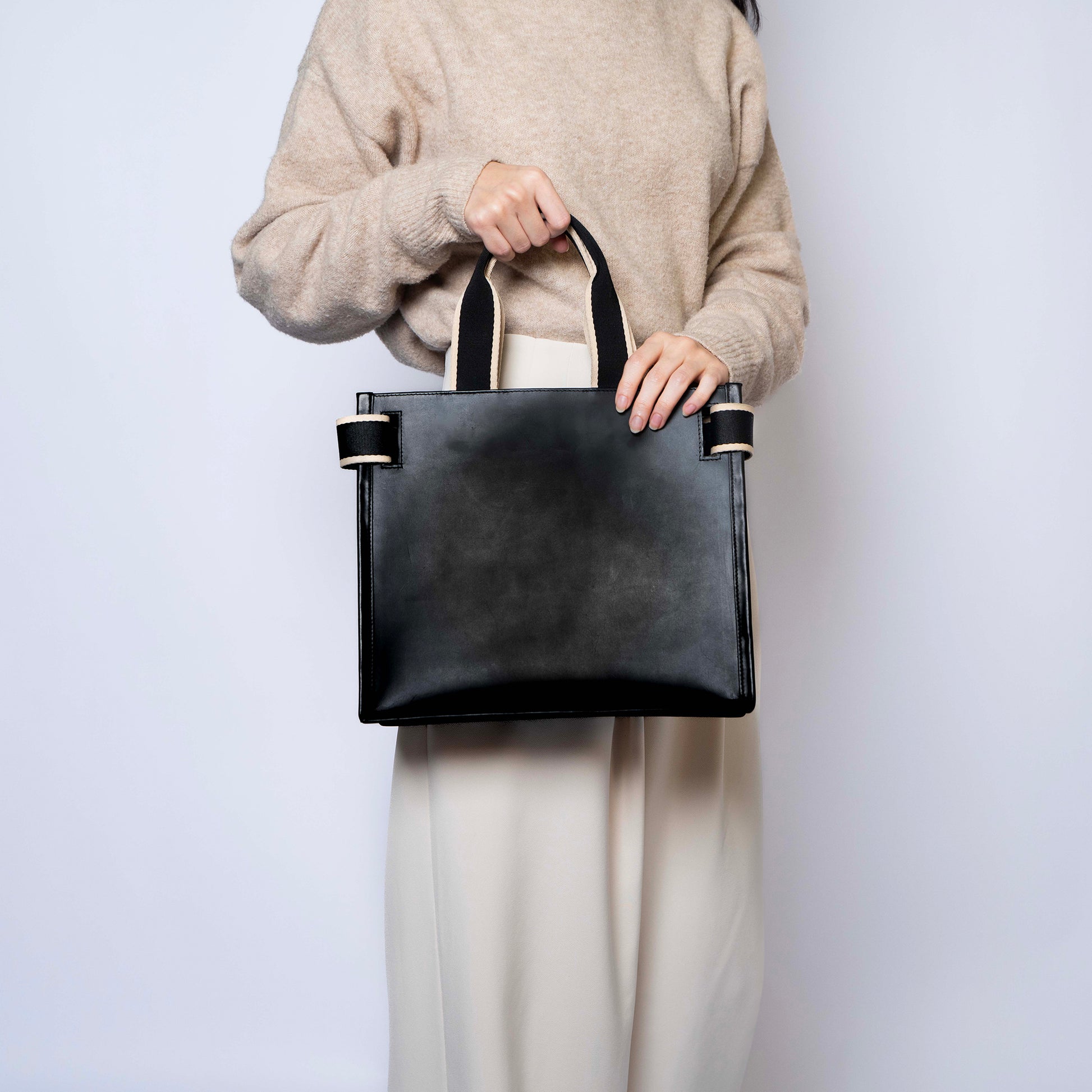 NUMÉRO 02 by atelier &LAB — rear view revealing a composed, balanced volume with quiet luxury presence in premium upcycled full-grain calf leather, Paris.