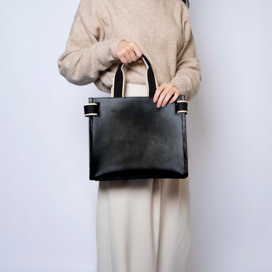 NUMÉRO 02 by atelier &LAB — rear view revealing a composed, balanced volume with quiet luxury presence in premium upcycled full-grain calf leather, Paris.