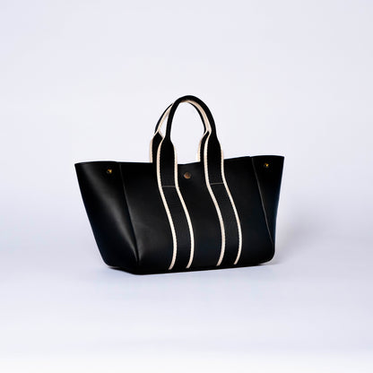 Everyday leather tote bag — NUMÉRO 03 by atelier &LAB, black upcycled full-grain calf leather, front three-quarter view showing an open shape and easy access for daily essentials.