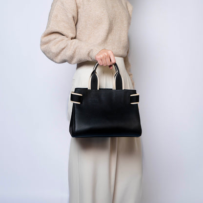 NUMÉRO 04 by atelier &LAB — clean rear angle revealing a composed, sculptural volume with quiet luxury presence in premium upcycled full-grain calf leather, Paris.