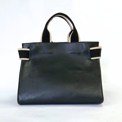 Structured leather handbag — NUMÉRO 04 M prototype by atelier &LAB, rear view showing clean structured back panel