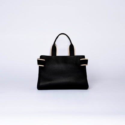 NUMÉRO 04 by atelier &LAB — rear view revealing a calm, graphic volume with quiet luxury presence in premium upcycled full-grain calf leather, Paris.