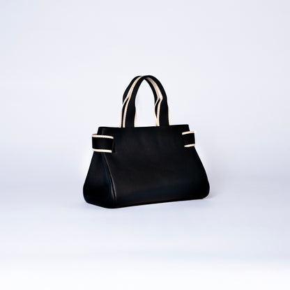 NUMÉRO 04 by atelier &LAB — rear three-quarter view expressing a deep black, architectural silhouette with composed volume in premium upcycled full-grain calf leather, Paris.