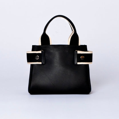 Mini leather handbag in black — NUMÉRO 04 by atelier &LAB, front view, compact graphic shape