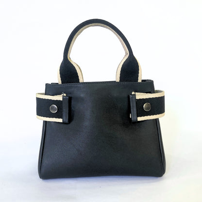 Structured leather handbag — NUMÉRO 04 Mini prototype by atelier &LAB, frontal view showing compact structured shape