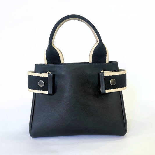 Structured leather handbag — NUMÉRO 04 Mini prototype by atelier &LAB, frontal view showing compact structured shape