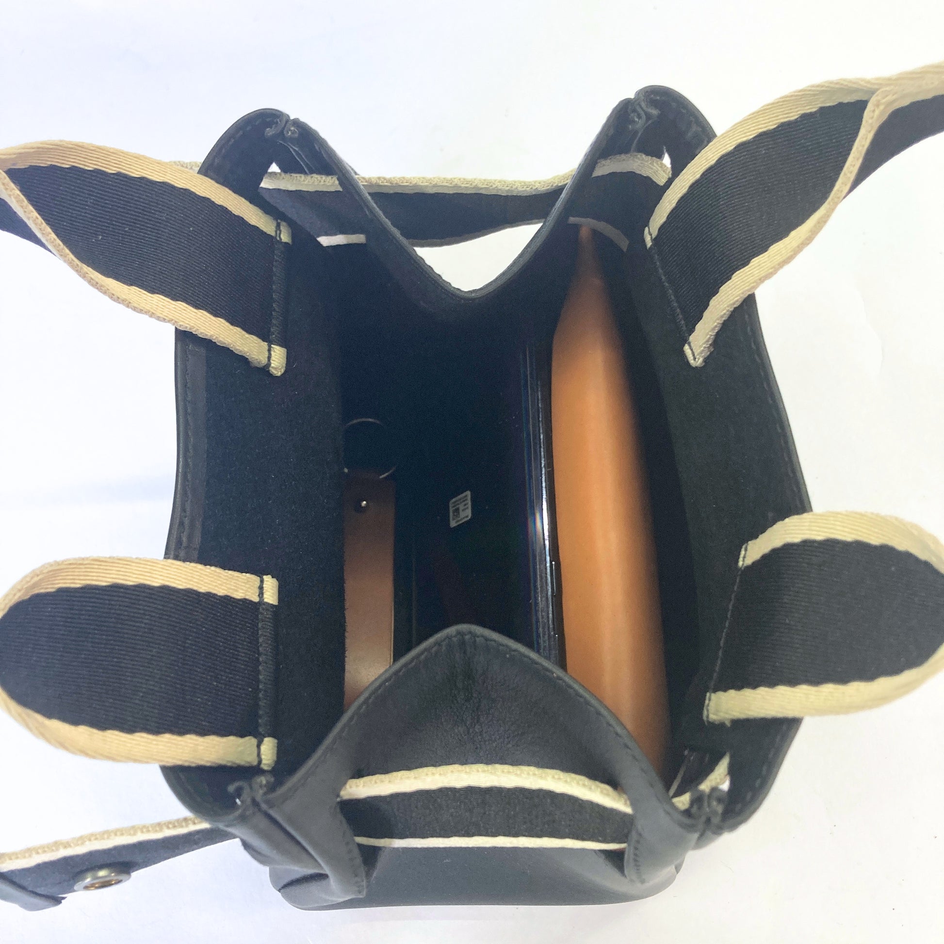 Structured leather handbag — NUMÉRO 04 Mini prototype by atelier &LAB, interior top view showing compartments and structured construction