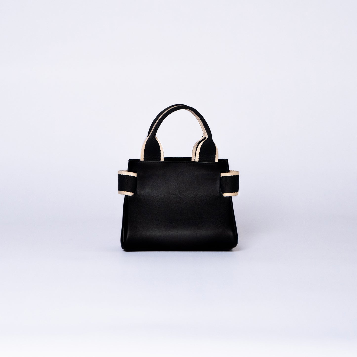 NUMÉRO 04 mini by atelier &LAB — rear view revealing a compact, essential architectural volume with refined quiet luxury in premium upcycled full-grain calf leather, Paris.