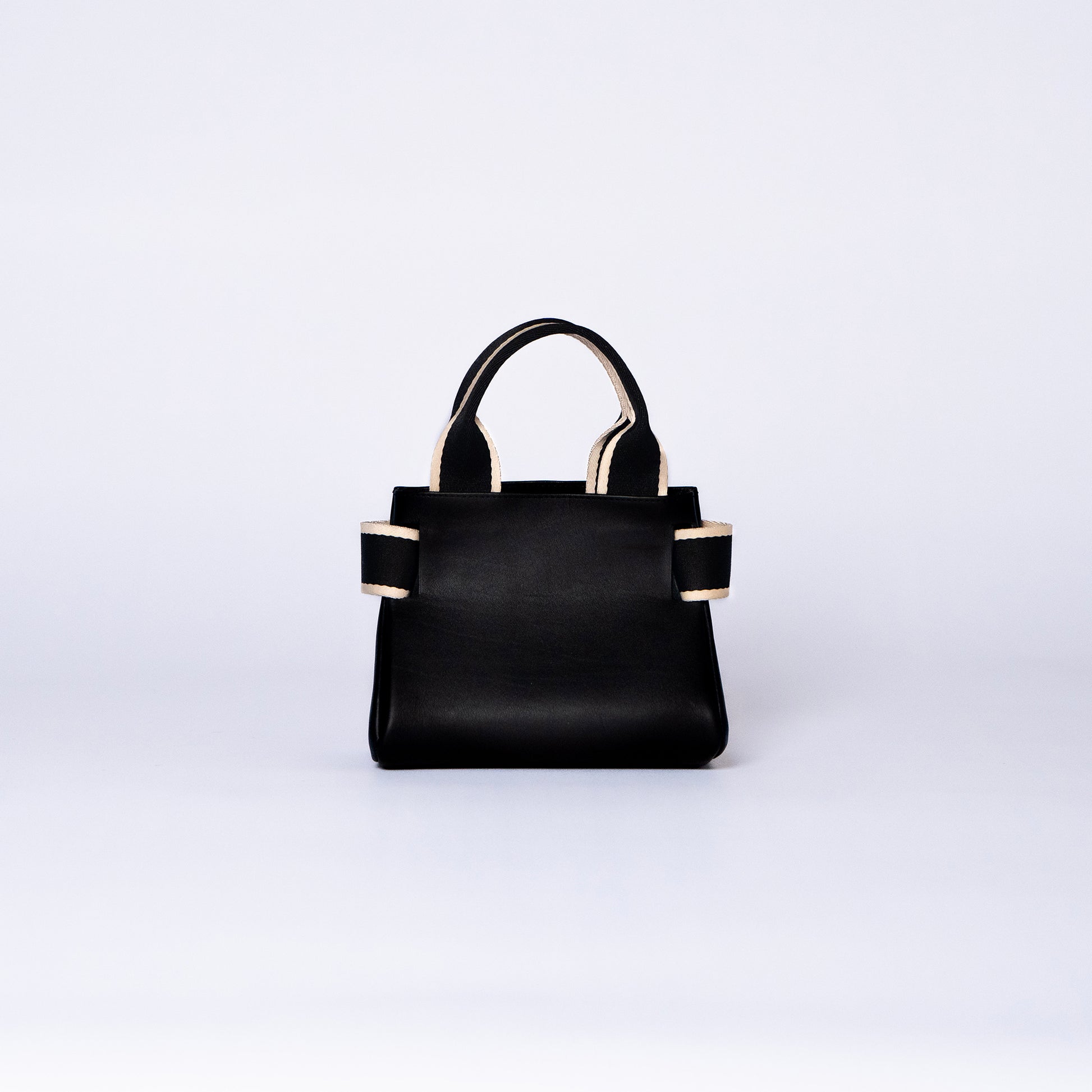 NUMÉRO 04 mini by atelier &LAB — rear view revealing a compact, essential architectural volume with refined quiet luxury in premium upcycled full-grain calf leather, Paris.