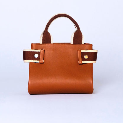 Mini leather handbag in cognac — NUMÉRO 04 by atelier &LAB, front view, compact graphic shape