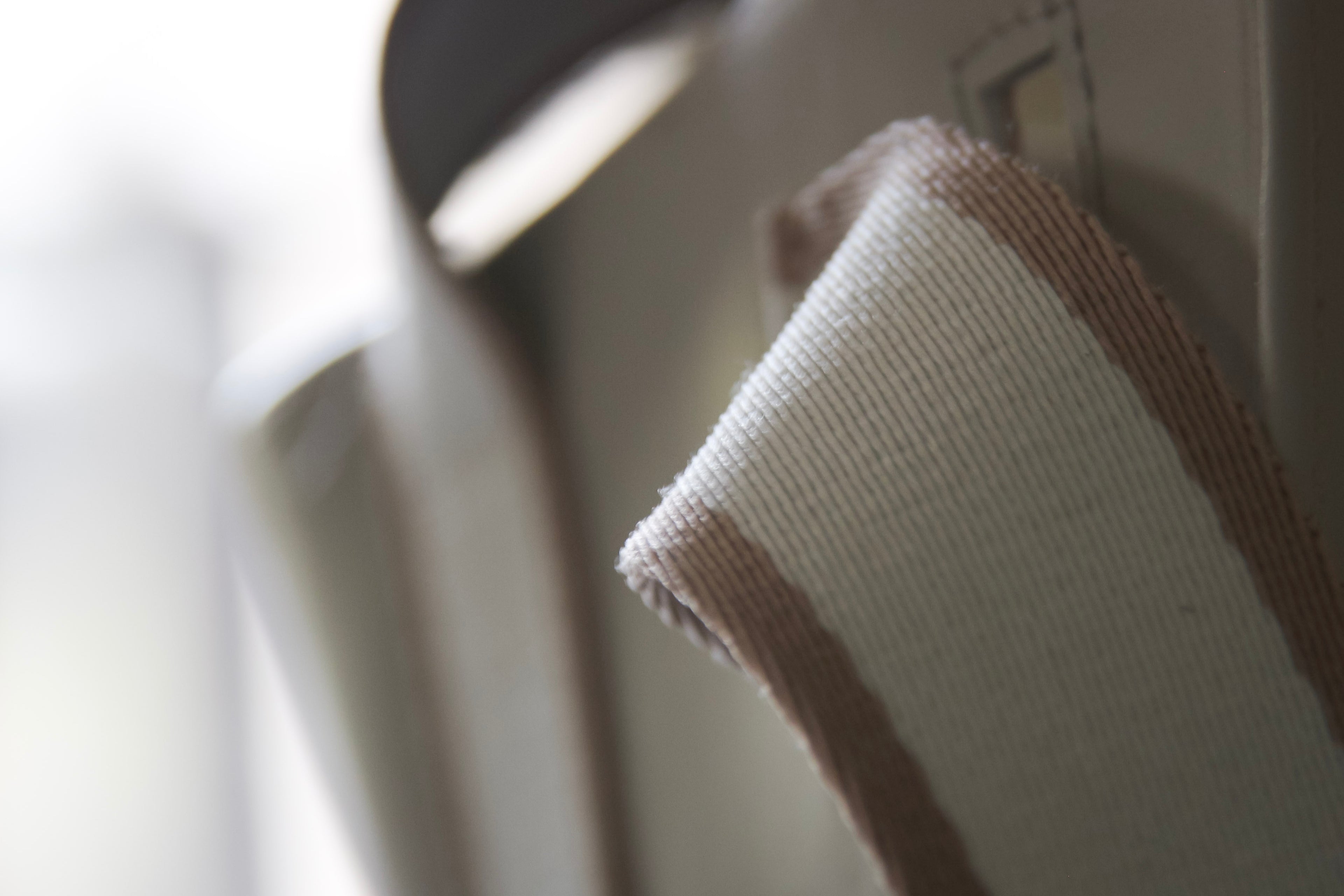 Leather and technical textile contrast — structural detail at &LAB studio, Paris.