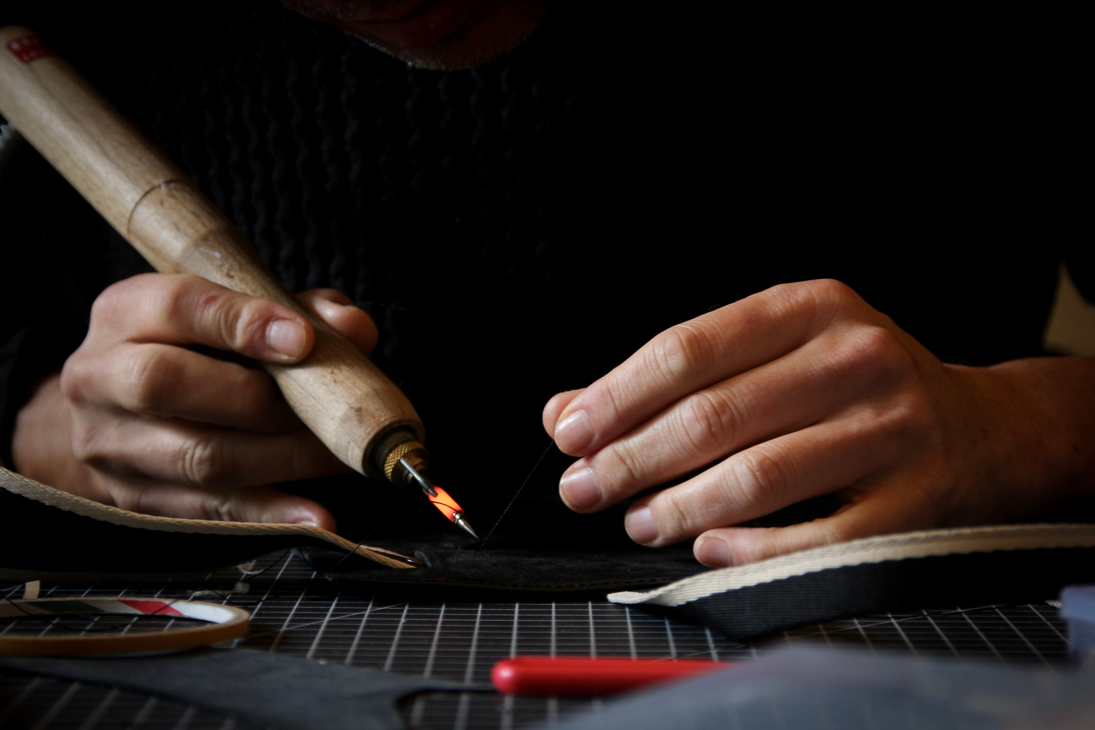 hread cutting on premium leather — precise structural detailing at &LAB studio, Paris.